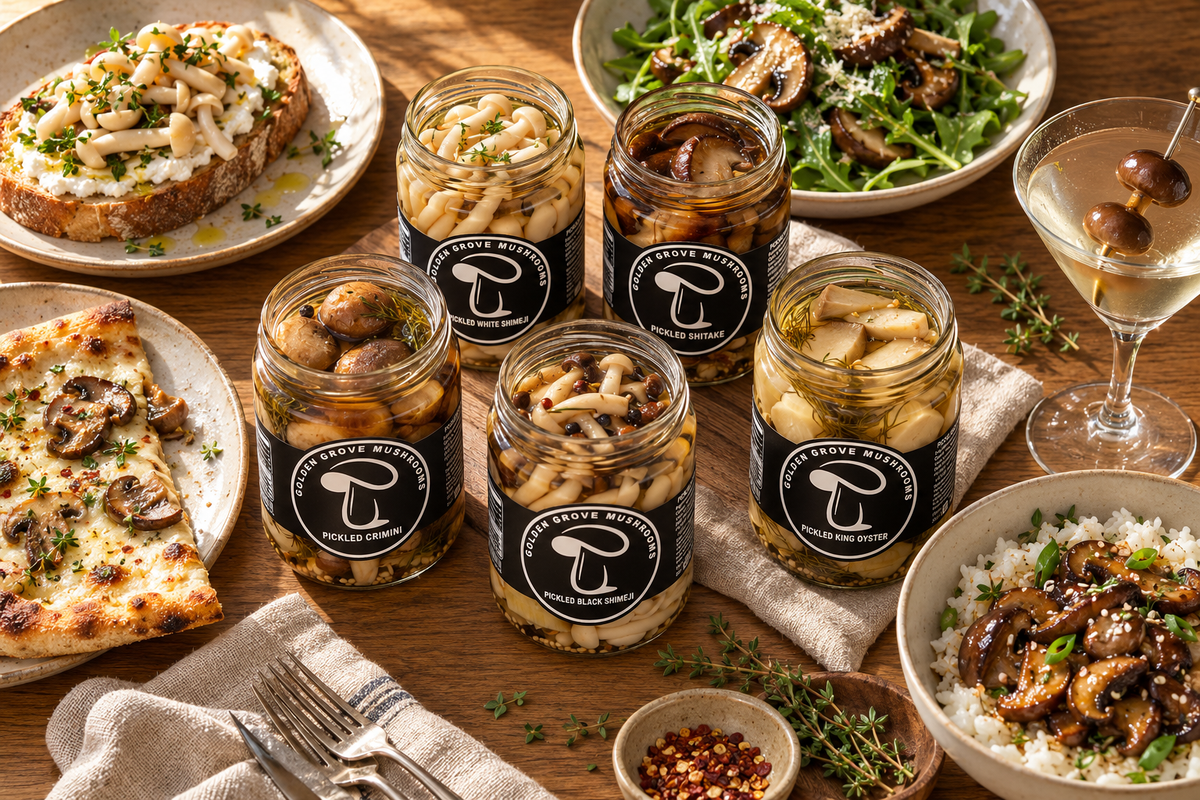 Five open jars of pickled mushrooms surrounded by ricotta toast, a salad, a pizza and a martini
